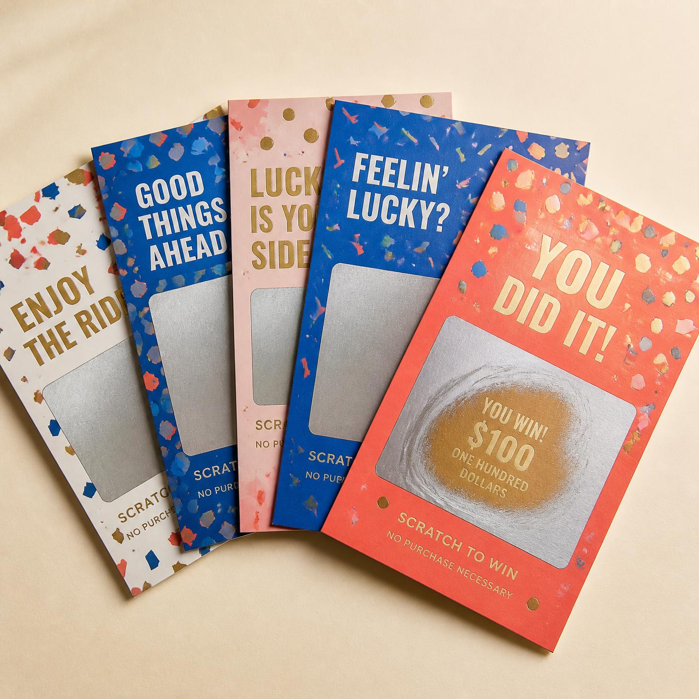 Stack of finished custom scratch off cards in multiple sizes